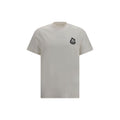 T-shirt beige en coton de la marque Moncler, coupe classique, visible avec col rond et logo discret sur la poitrine.