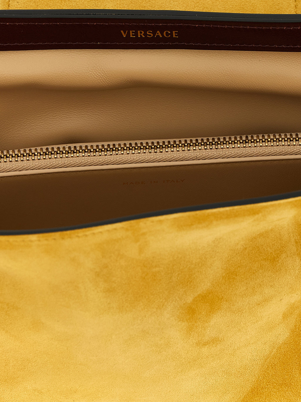 Sac clutch en cuir bicolore Versace, élégante pochette pour femme avec détails sophistiqués et logo emblématique.
