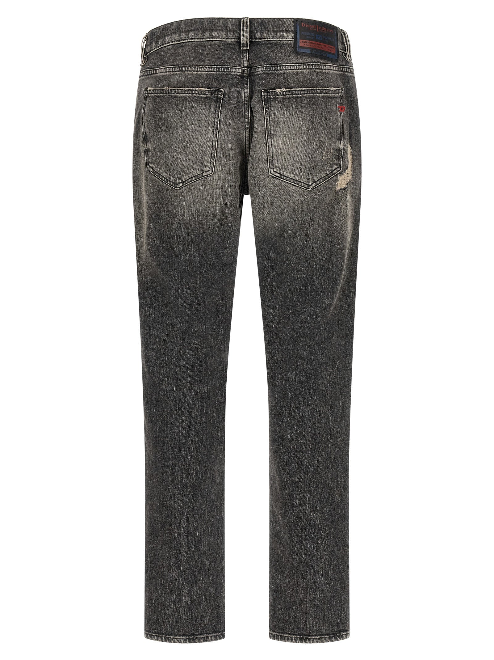 Jeans skinny en coton gris de marque Diesel, coupe ajustée, visible en détail dans l'image.