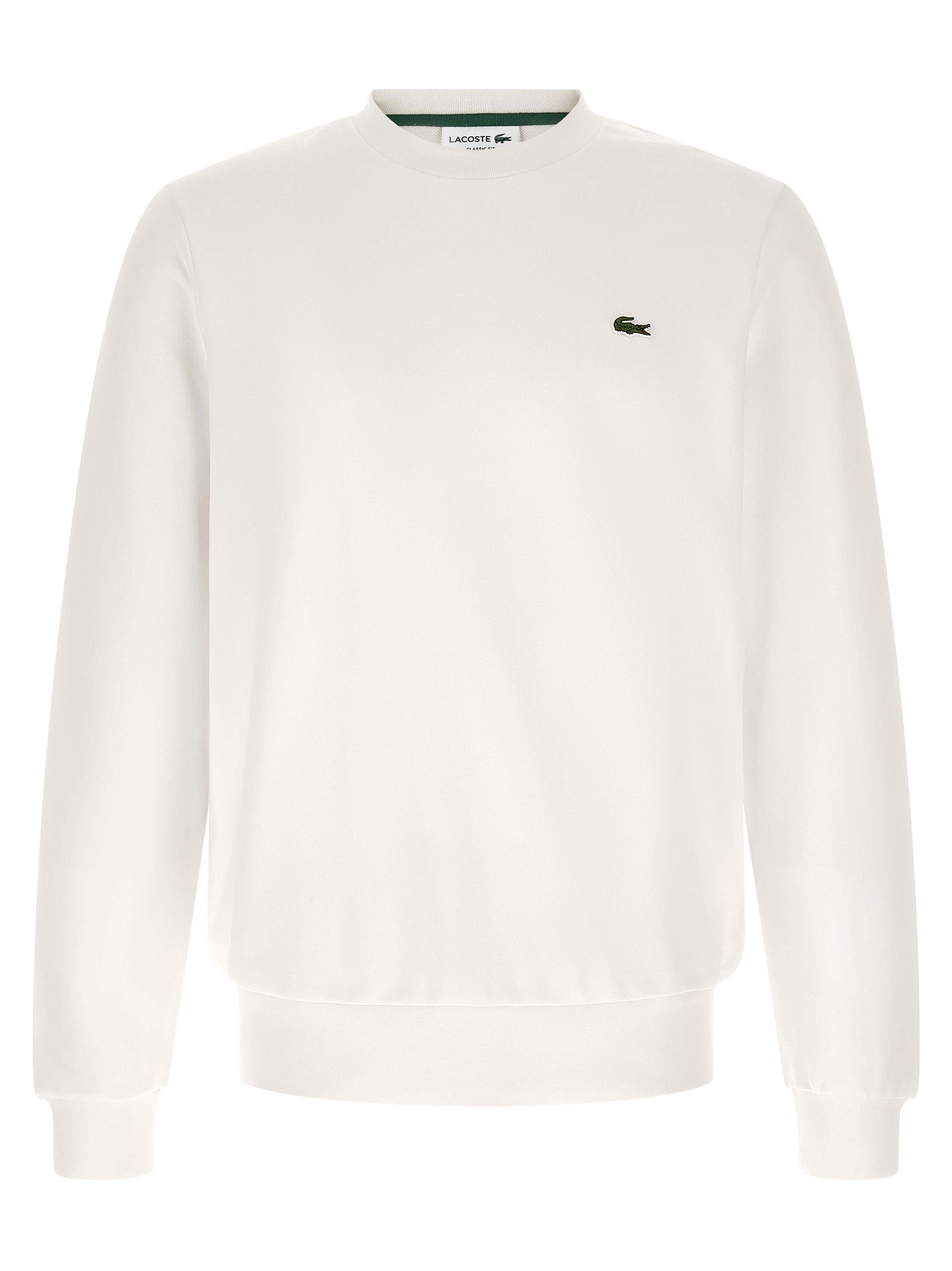Sweat-shirt blanc en coton de marque Lacoste, avec logo crocodile sur la poitrine, porté sur un mannequin.