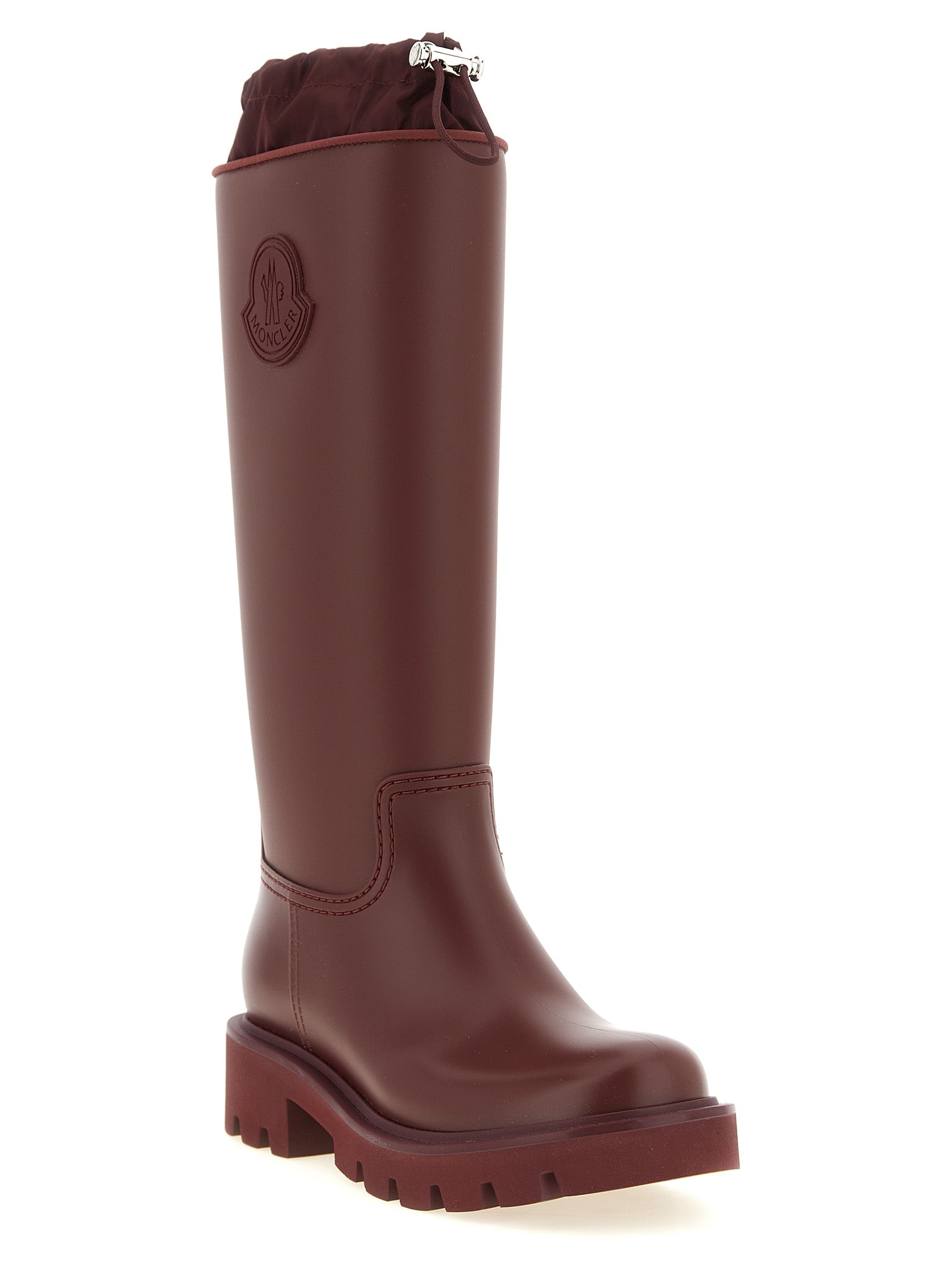Bottes Moncler Bordeaux en PVC, montantes au-dessus du genou, avec style élégant et finition brillante.
