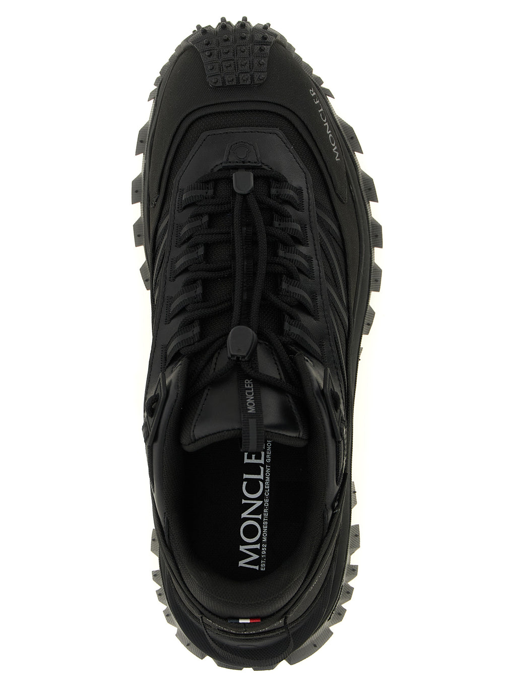 Chaussures de sport Moncler en cuir noir, baskets athlétiques élégantes avec design moderne et semelle résistante.