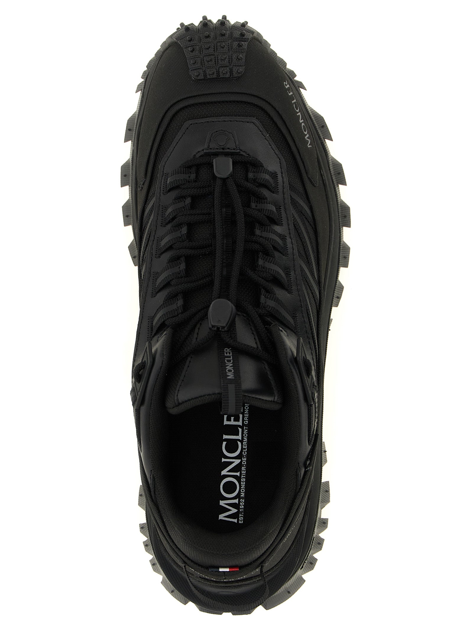 Chaussures de sport Moncler en cuir noir, baskets athlétiques élégantes avec design moderne et semelle résistante.
