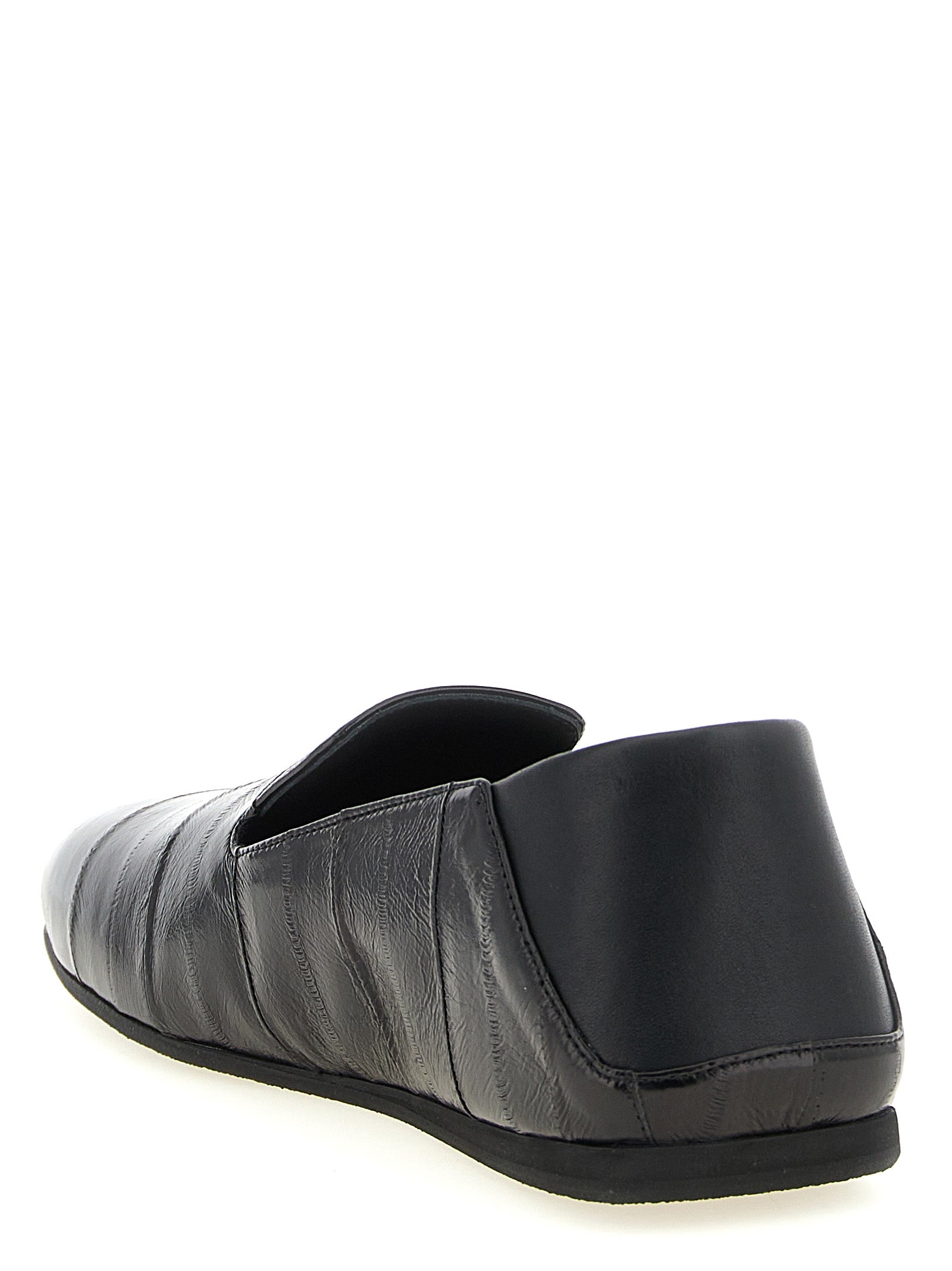 Chaussures mocassins en cuir noir Giuseppe Zanotti, slip-on élégants pour homme, avec finition lisse et design sophistiqué.