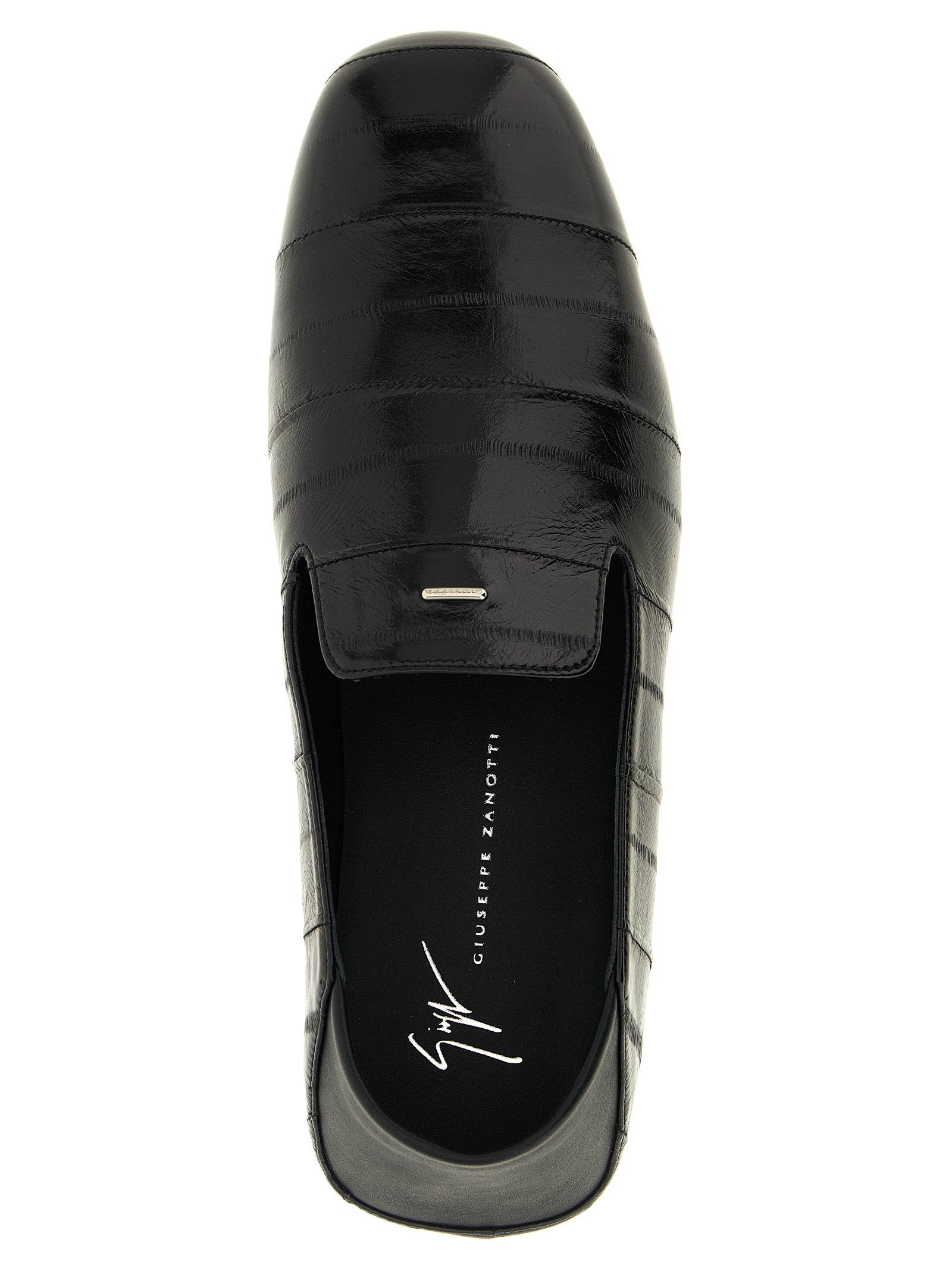 Chaussures mocassins en cuir noir Giuseppe Zanotti pour homme, slip-on élégants et modernes, vue de profil.