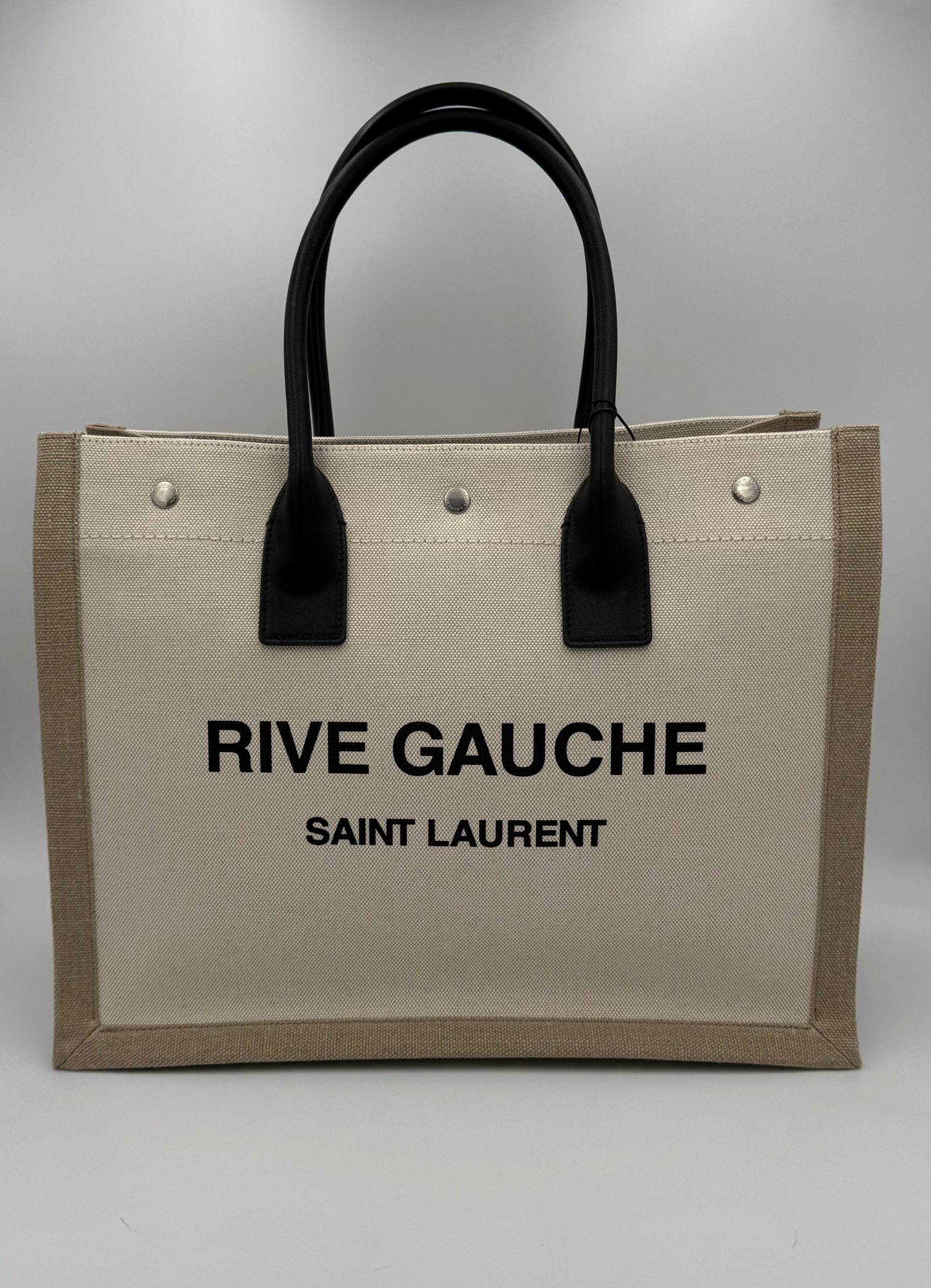 Sac cabas moyen Saint Laurent Rive Gauche en cuir noir avec logo emblématique sur le devant.