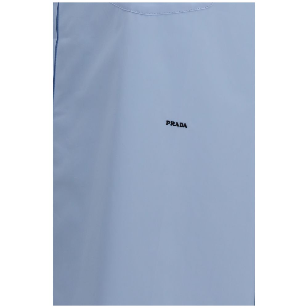 Chemise en coton bleue Prada pour homme, manches longues et col classique, tissu doux et élégant.