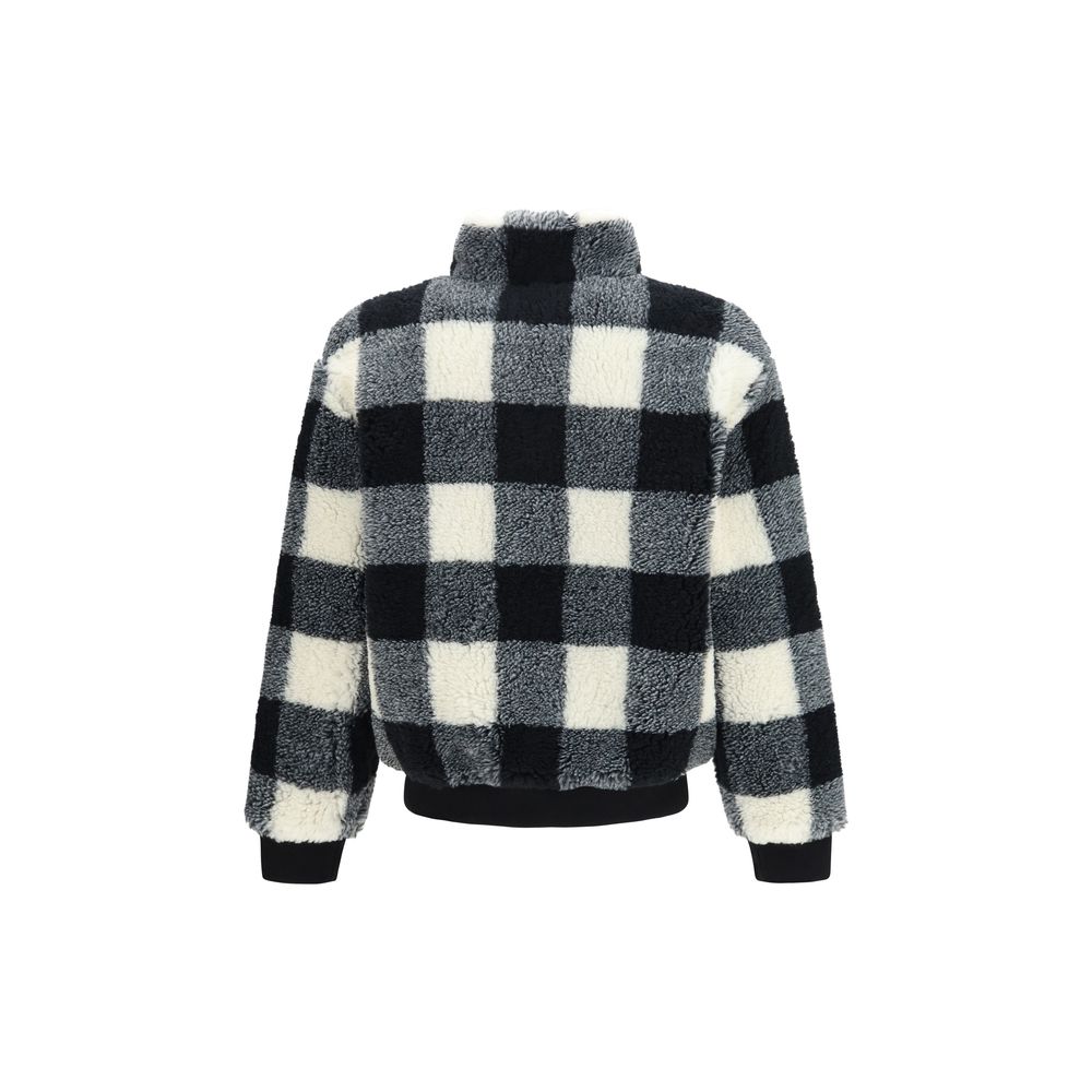 Veste longue en polyester gris de la marque Givenchy, coupe élégante et moderne, visible en détail sur cette image.