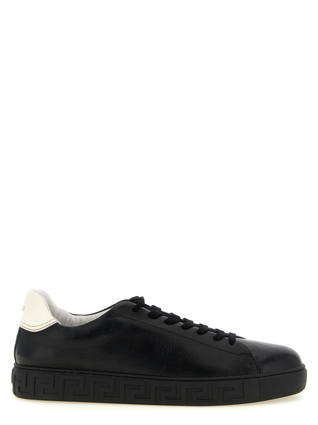Sneakers basses en cuir bicolore Versace pour homme, avec logo distinctif et design élégant.