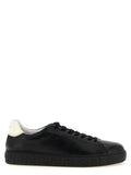 Sneakers basses en cuir bicolore Versace pour homme, avec logo distinctif et design élégant.