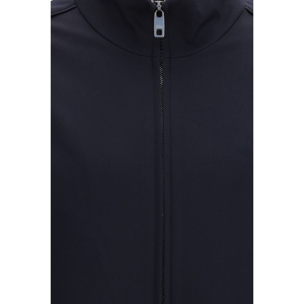 Veste longue en polyamide bleue de Dolce & Gabbana, style élégant et moderne, visible avec détails de couture et fermeture éclair.