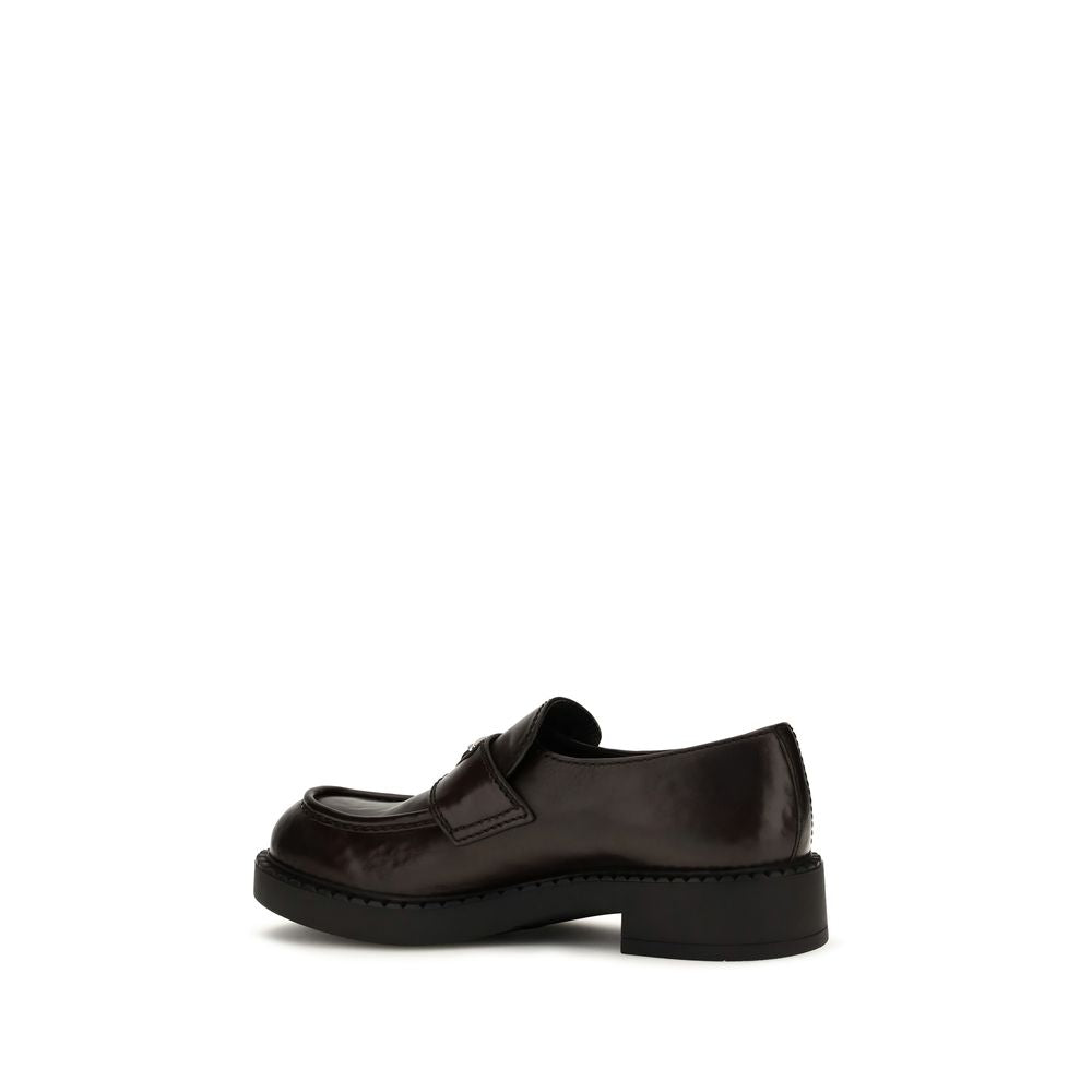 Mocassins Prada en cuir de veau marron Bos Taurus, chaussures slip-on élégantes et confortables pour homme.