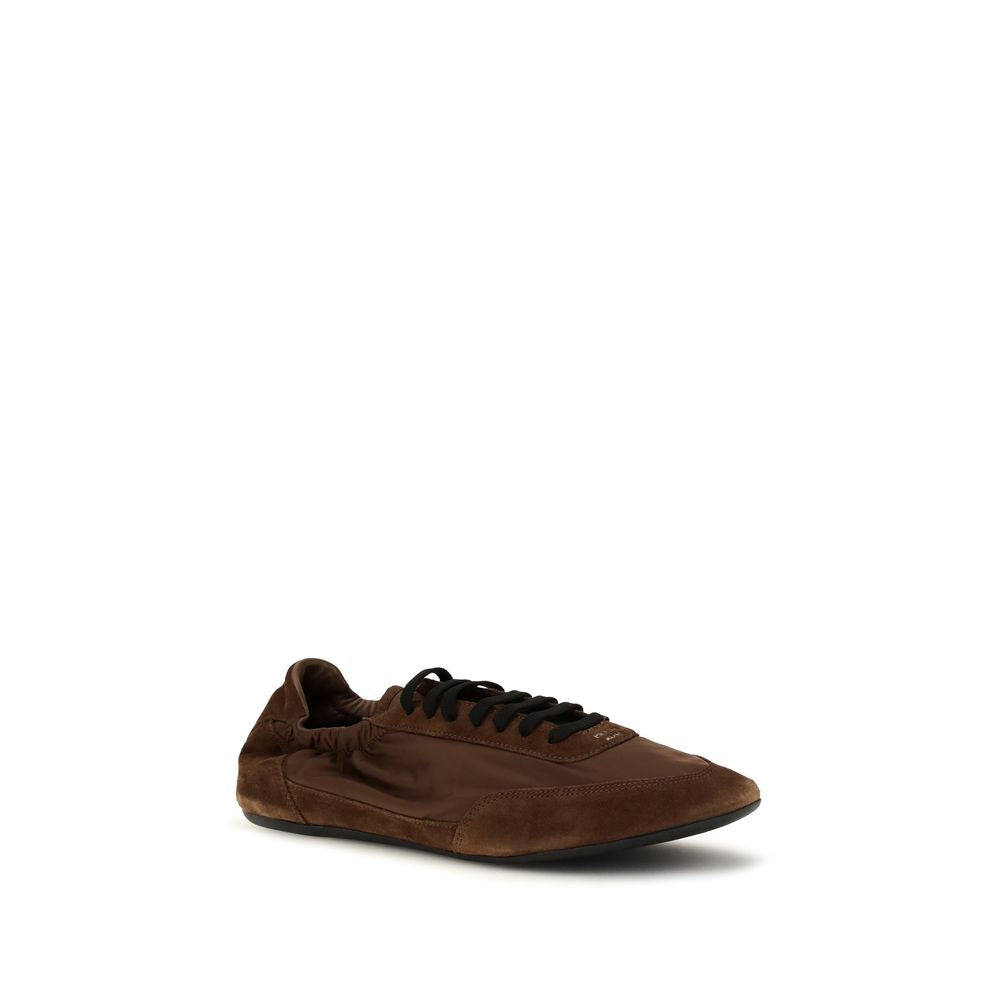 Chaussures de sport en caoutchouc marron Prada, baskets athlétiques élégantes avec design moderne et confort.