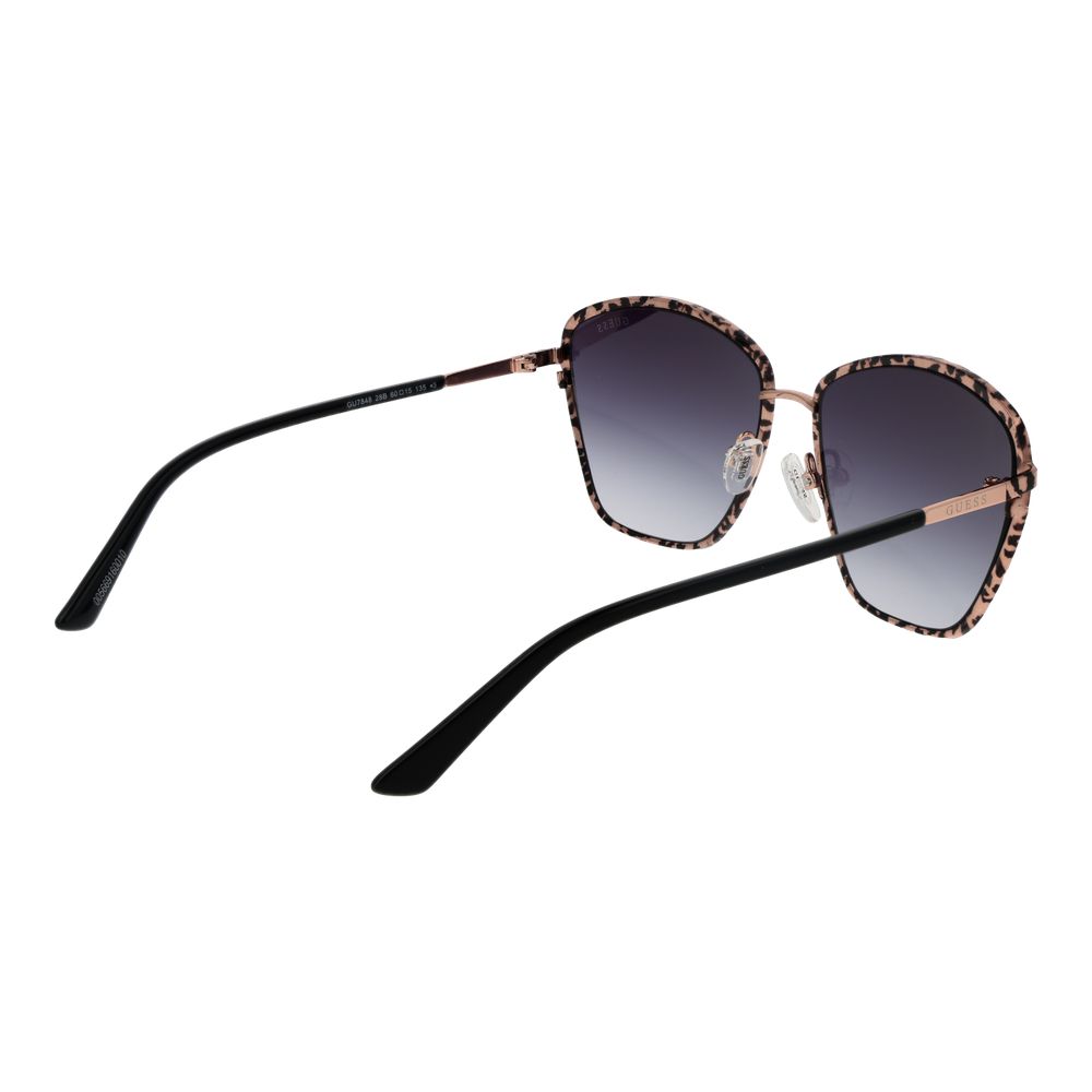 Lunettes de soleil en métal or rose Guess avec verres teintés, style élégant et moderne, vue de face sur fond blanc.