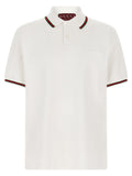 Chemise polo blanche en coton de Gucci, vue de face, avec col et boutons visibles.