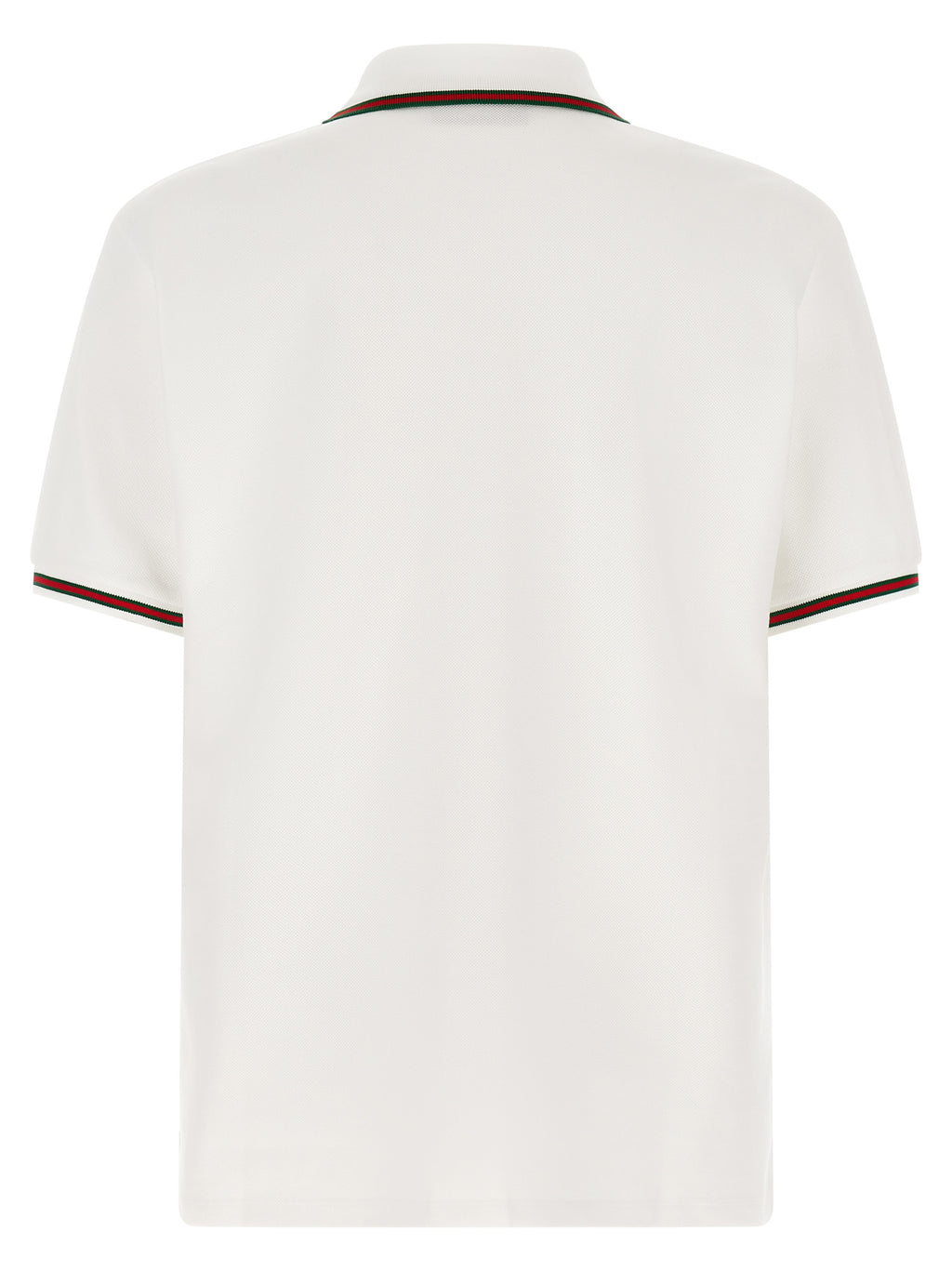 Chemise polo blanche en coton de Gucci avec logo discret, portée sur un mannequin.