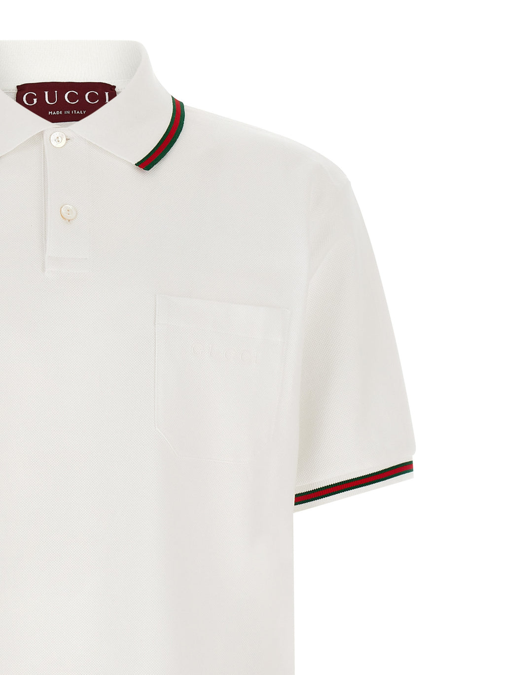Chemise polo en coton blanc Gucci, vue de face, avec logo emblématique, tissu doux et col classique.
