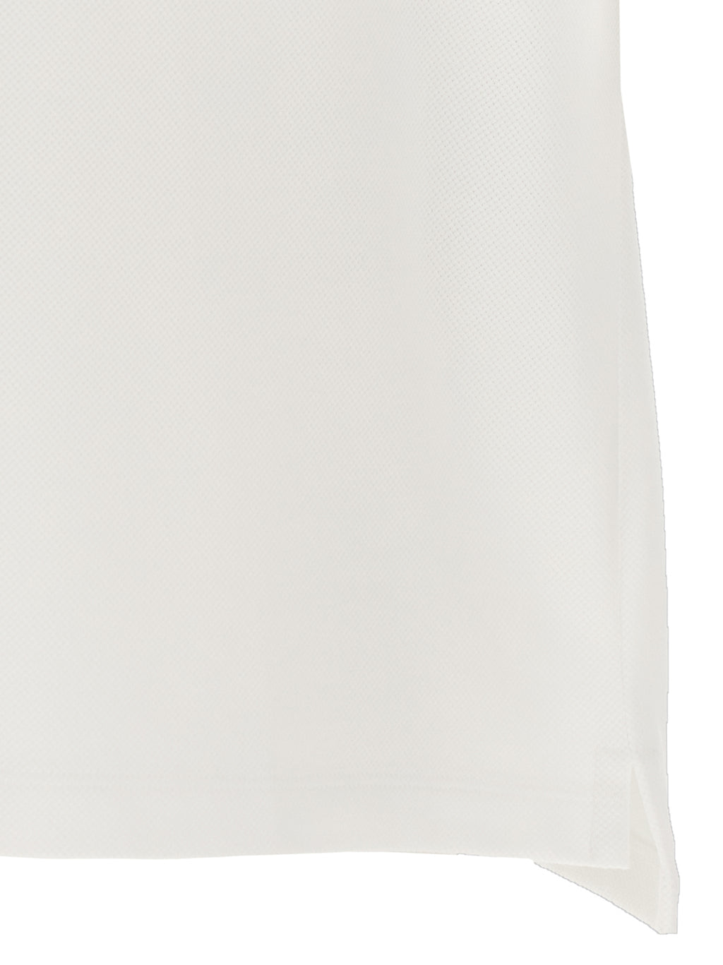 Chemise polo Gucci en coton blanc, vue de face, avec col classique et logo Gucci discret sur la poitrine.