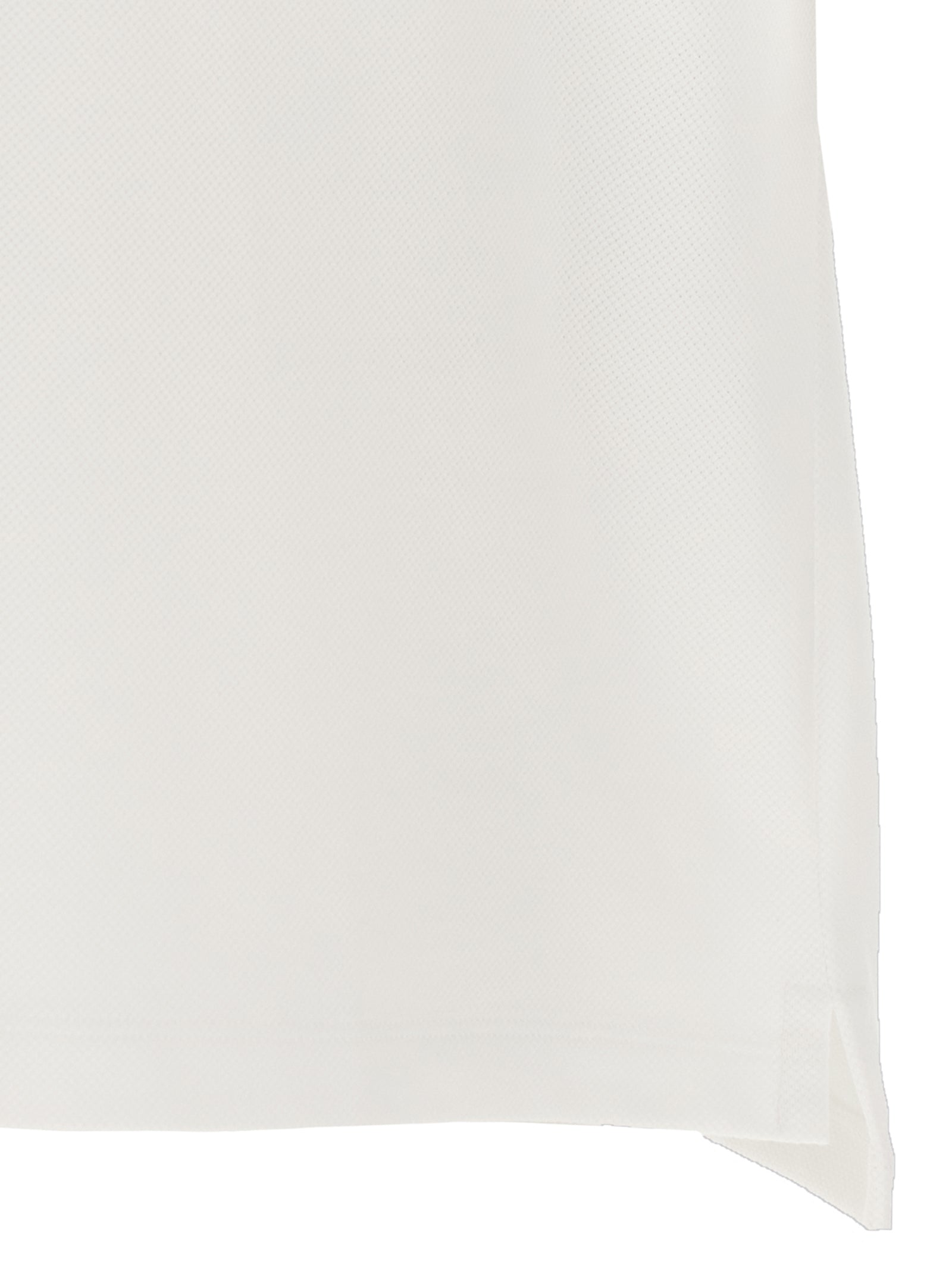 Chemise polo Gucci en coton blanc, vue de face, avec col classique et logo Gucci discret sur la poitrine.