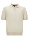 Chemise polo blanche en laine vierge de Hugo Boss, vue de face avec col et boutons visibles.