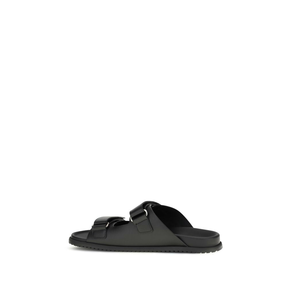 Sandales plates en cuir de veau noir de Dolce & Gabbana Bos Taurus, elegantes et confortables pour femme.