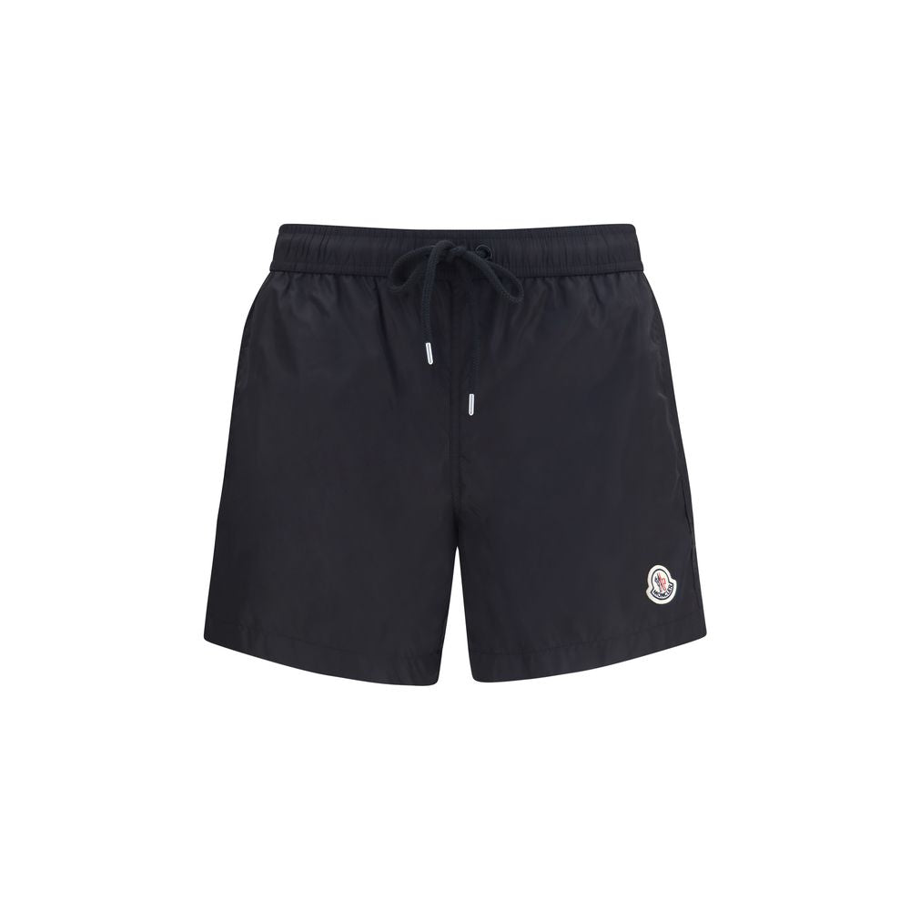 Veste de sport Moncler noire en polyamide, légère et résistante, idéale pour activités extérieures.