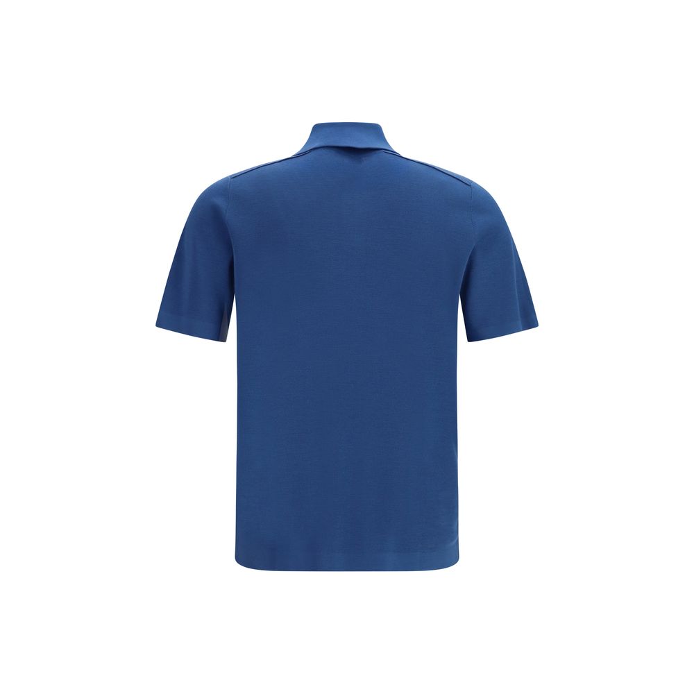 Polo homme Burberry en laine bleue avec motif Aries, col classique, détails élégants, tissu doux et confortable.