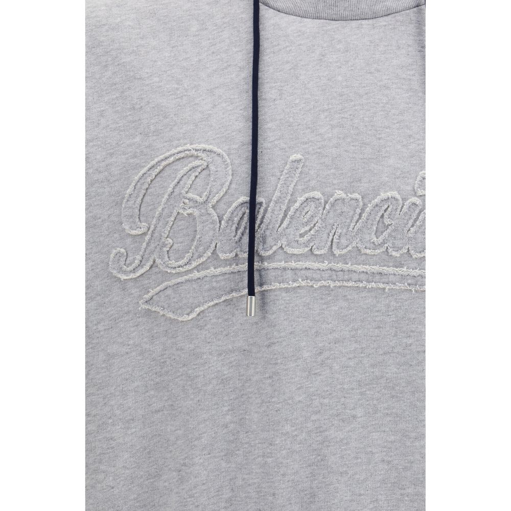 Sweat-shirt en coton multicolore de Balenciaga avec logo, porté sur mannequin, vue de face.
