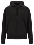Sweatshirt noire en coton de Hugo Boss, style décontracté, avec logo discret sur la poitrine, porté sur un mannequin.