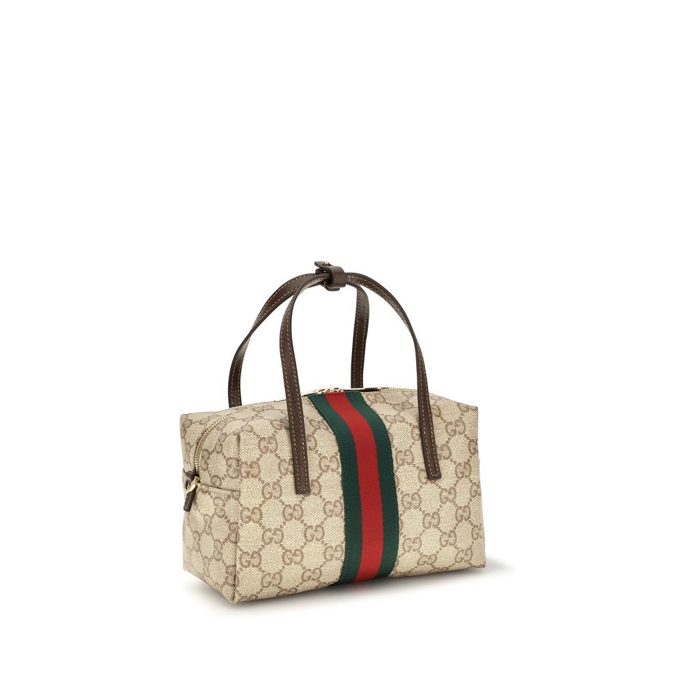 Sac à main en tissu beige Gucci, élégant et spacieux, avec détails en cuir et logo emblématique.
