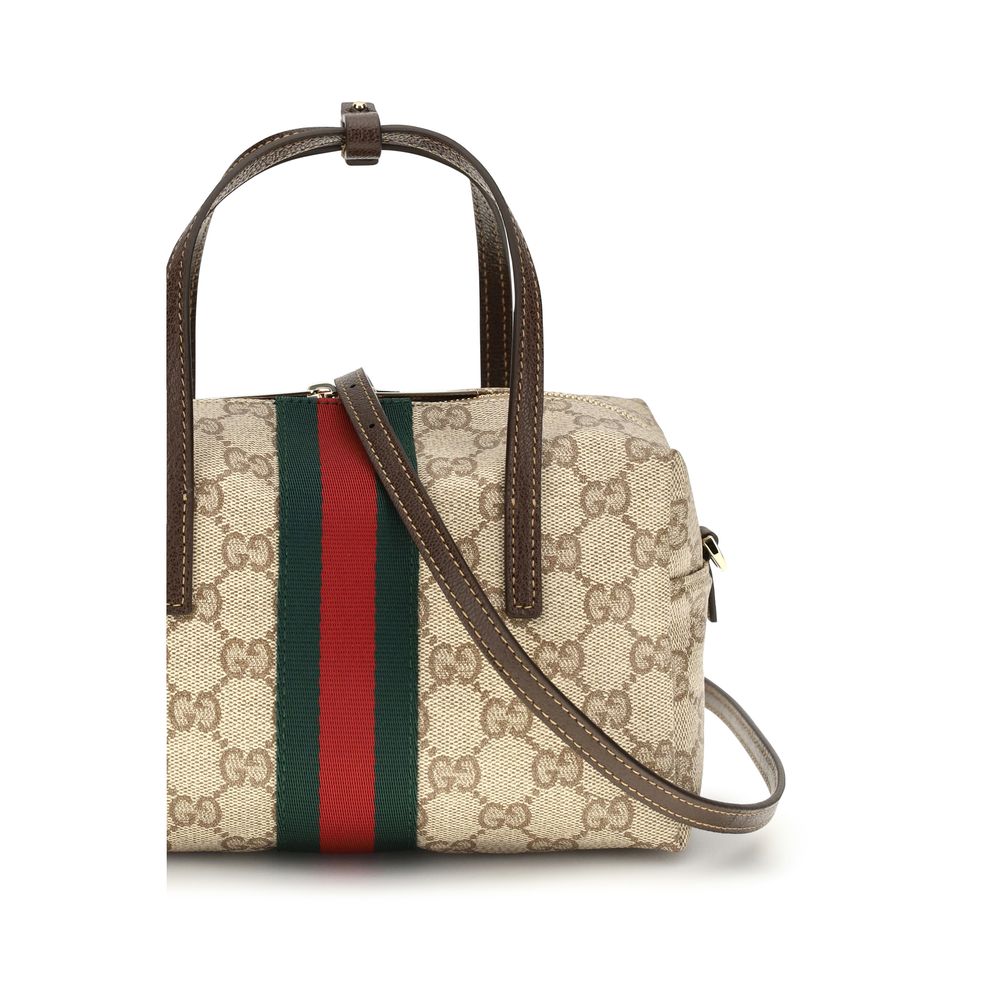 Sac à main en tissu beige Gucci, élégance et style, avec détails sophistiqués visibles sur l'image.