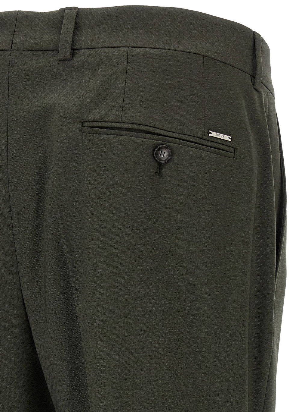 Pantalon en laine vierge bicolore de Hugo Boss, coupe élégante et moderne, porté sur un mannequin.