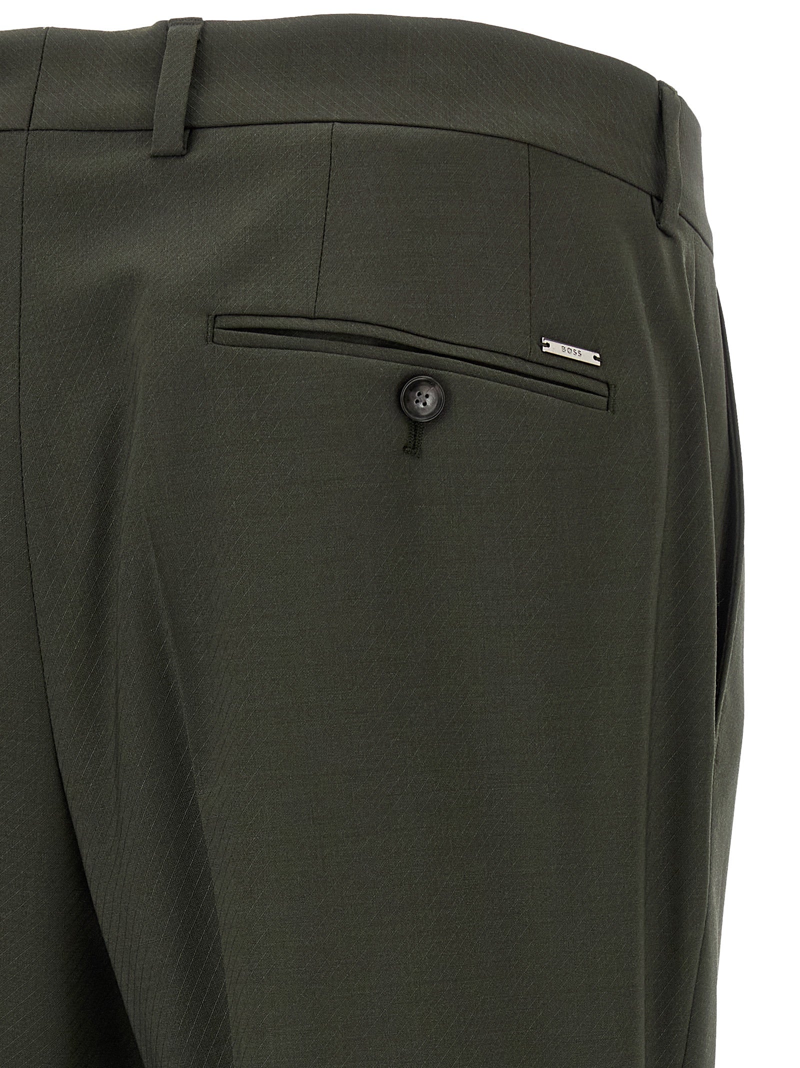 Pantalon en laine vierge bicolore de Hugo Boss, coupe élégante et moderne, porté sur un mannequin.