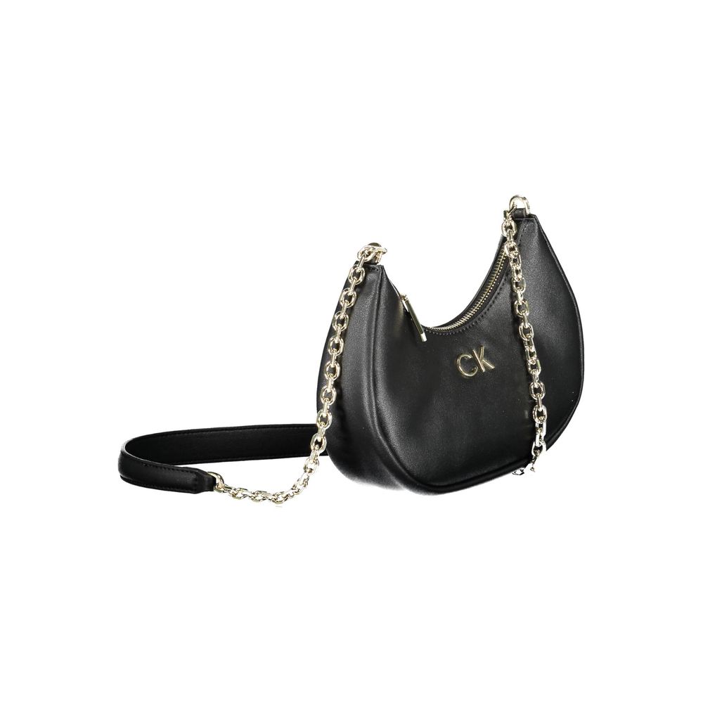 Sac à main pour femme Calvin Klein en polyester noir, bandoulière et design élégant visible dans l’image.