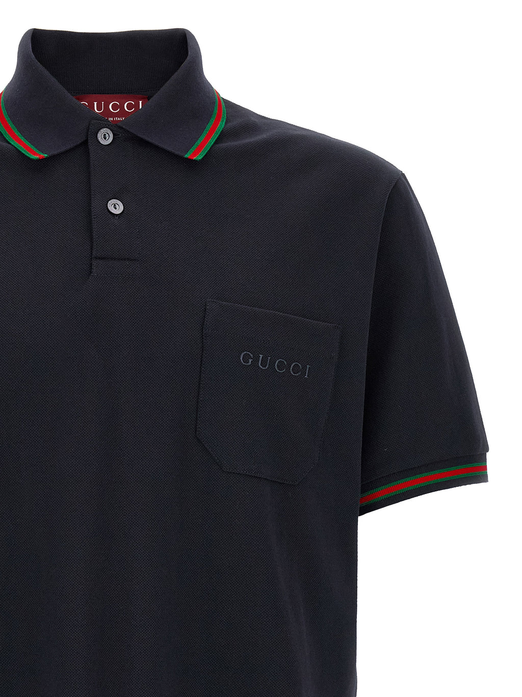 Chemise polo en coton bleu de Gucci, vue de face, avec col classique et logo Gucci visible sur la poitrine.
