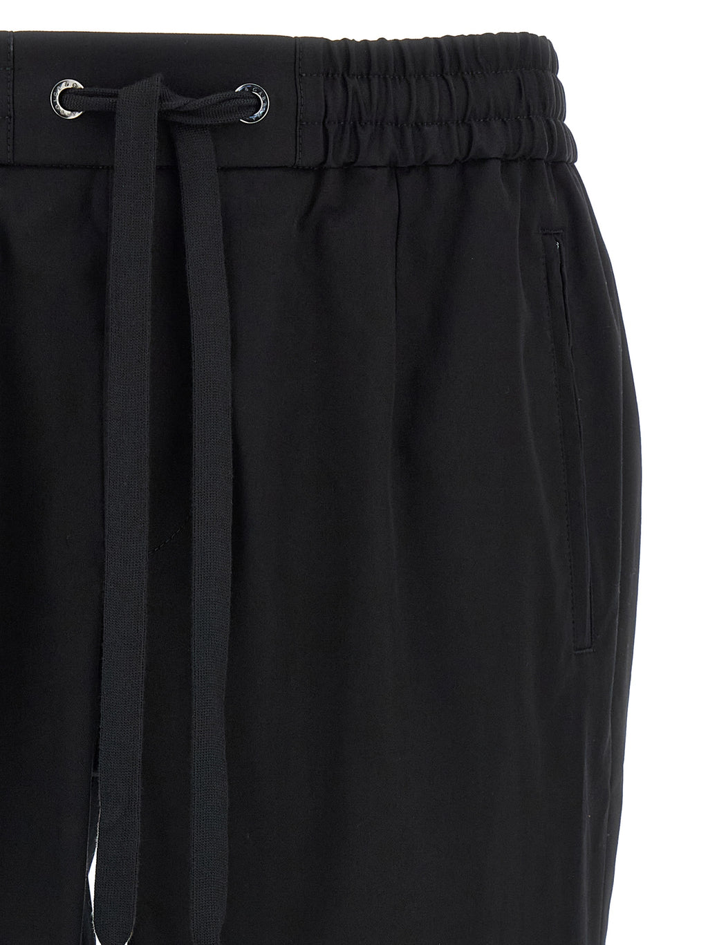 Pantalon décontracté en coton noir de Dolce & Gabbana, style casual, avec coupe ajustée et détails élégants.