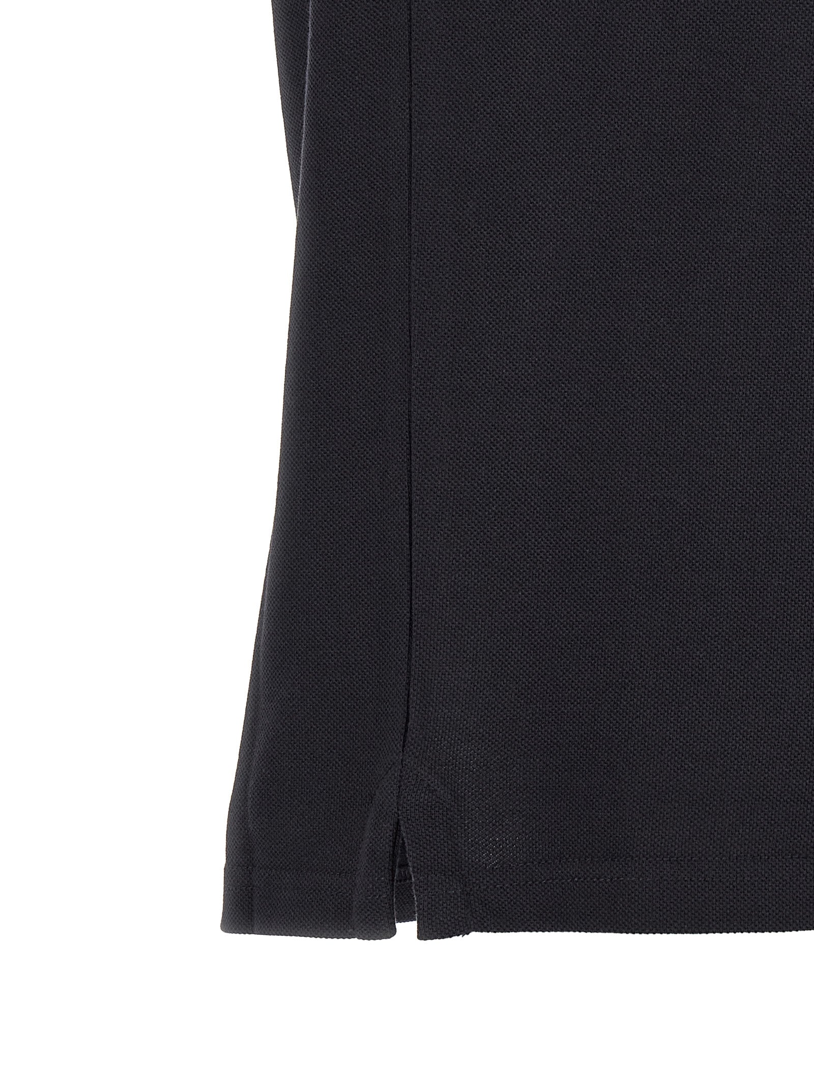 Chemise polo en coton bleu Moncler avec col et boutons, vue de face.