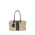 Sac à main en tissu beige Gucci, élégant et sophistiqué, avec détails de la marque, idéal pour un style chic et moderne.