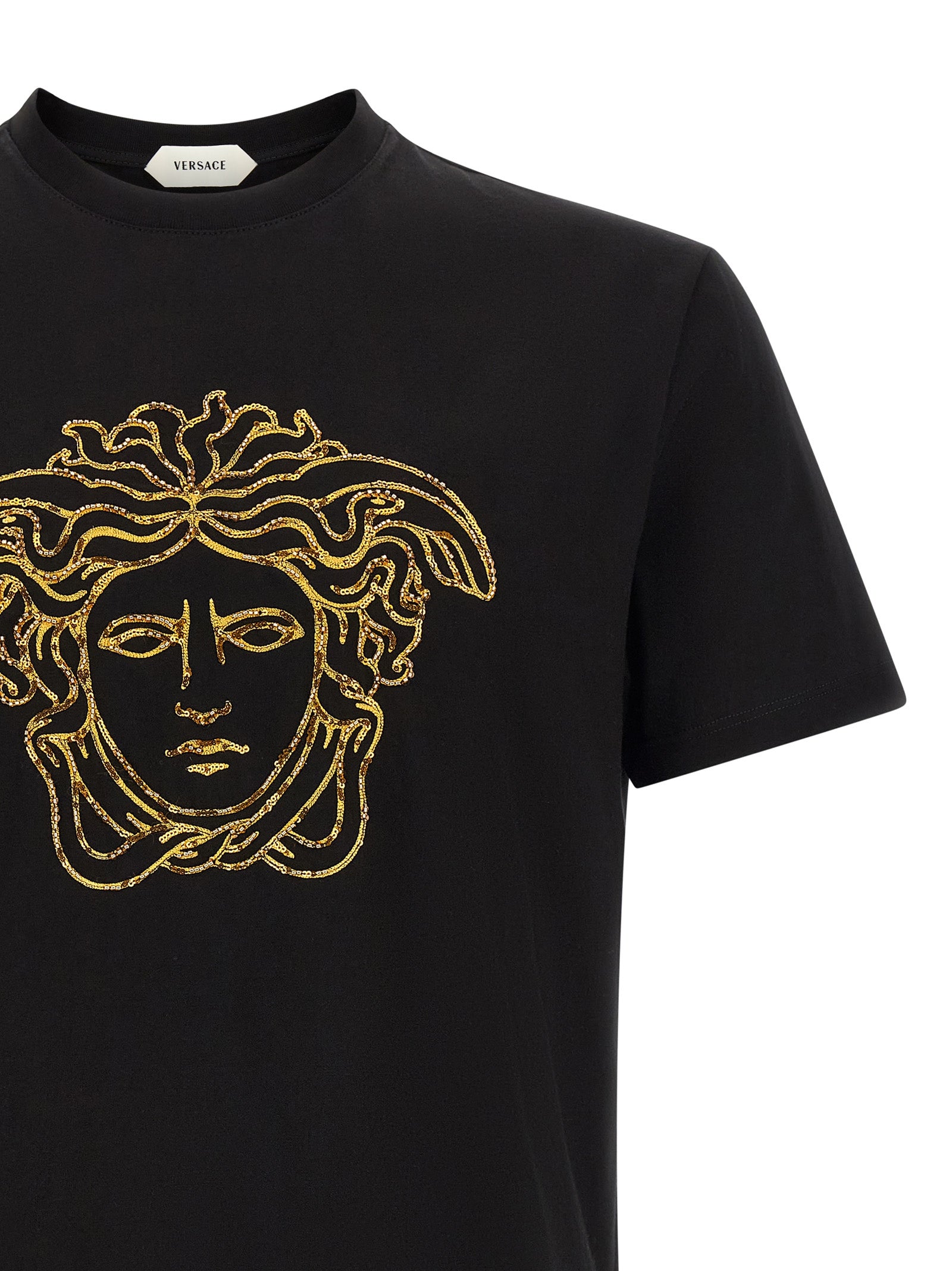 T-shirt noir en coton de la marque Versace, vue de face, avec logo distinctif visible sur le devant.