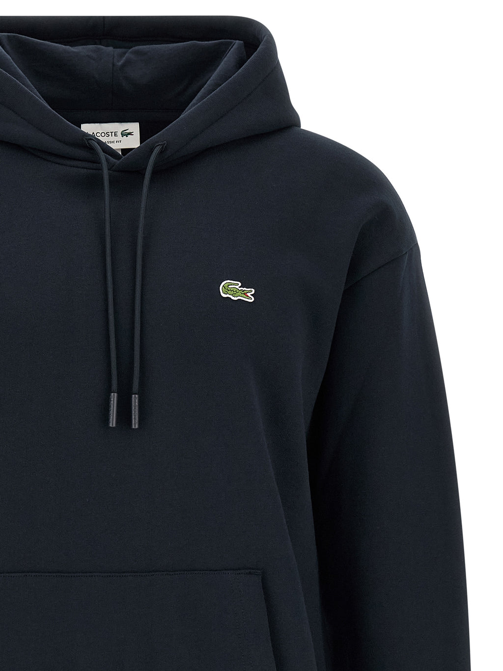 Sweatshirt en coton bleu Lacoste, coupe classique avec logo crocodile vert sur la poitrine, vue de face.