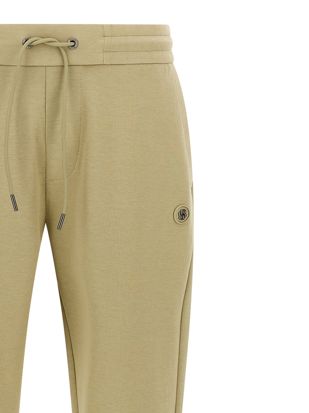 Pantalons de jogging en coton beige de Hugo Boss pour homme, style décontracté et confort, visibles sur l'image.