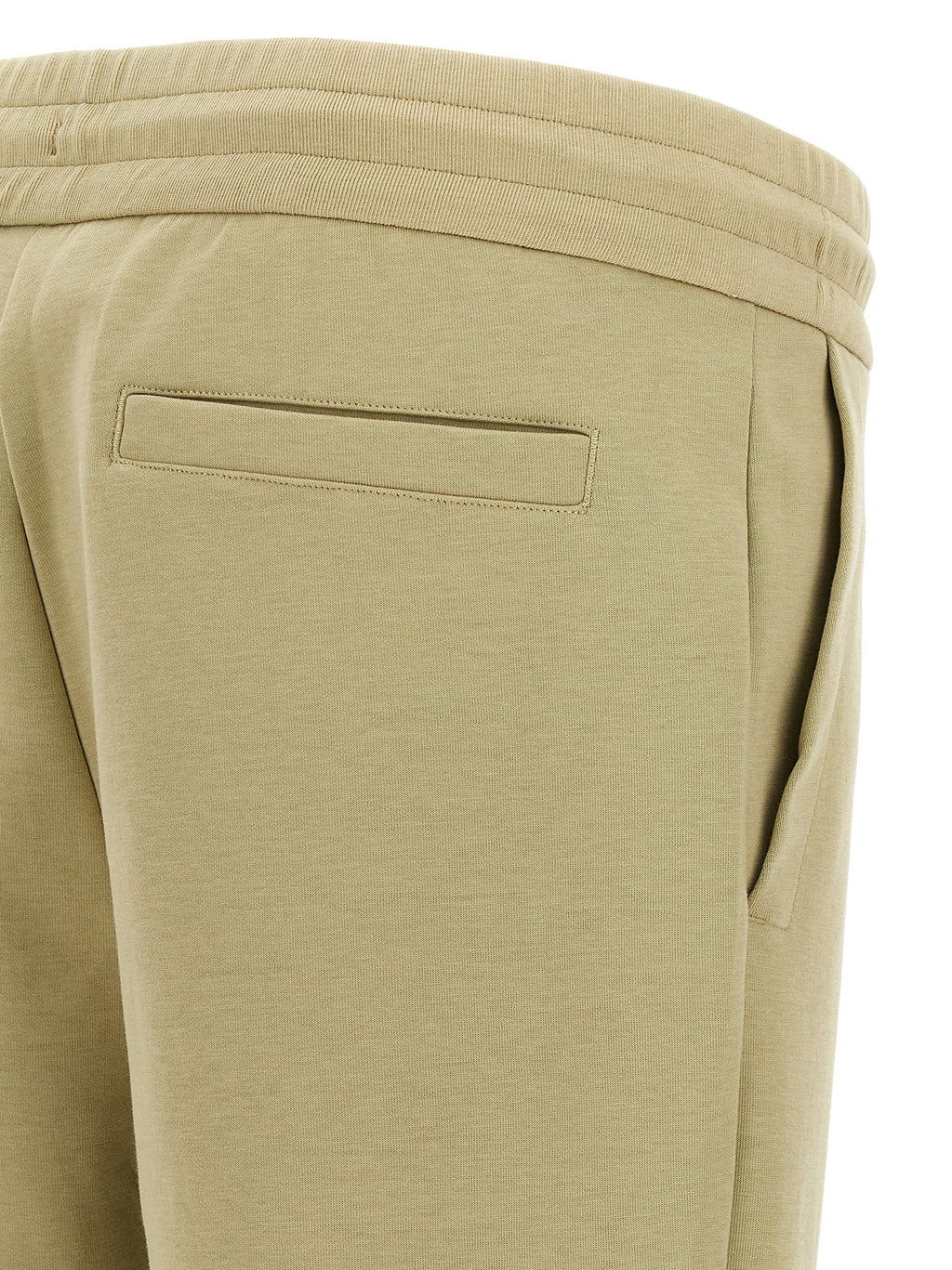 Pantalons de jogging en coton beige Hugo Boss pour entraînement, avec taille élastique et poches latérales.