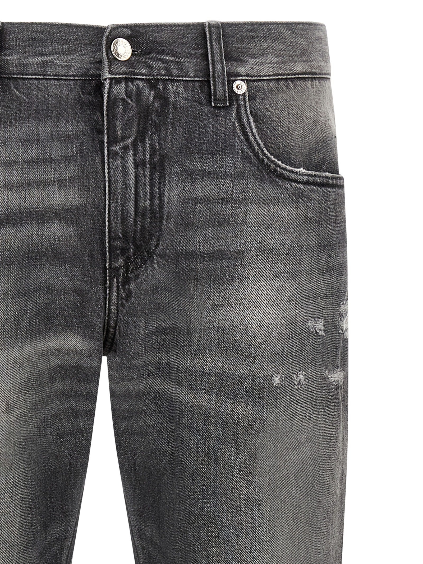 Jeans en denim gris Dolce & Gabbana en coton avec coupe classique, visibles sur le modèle.