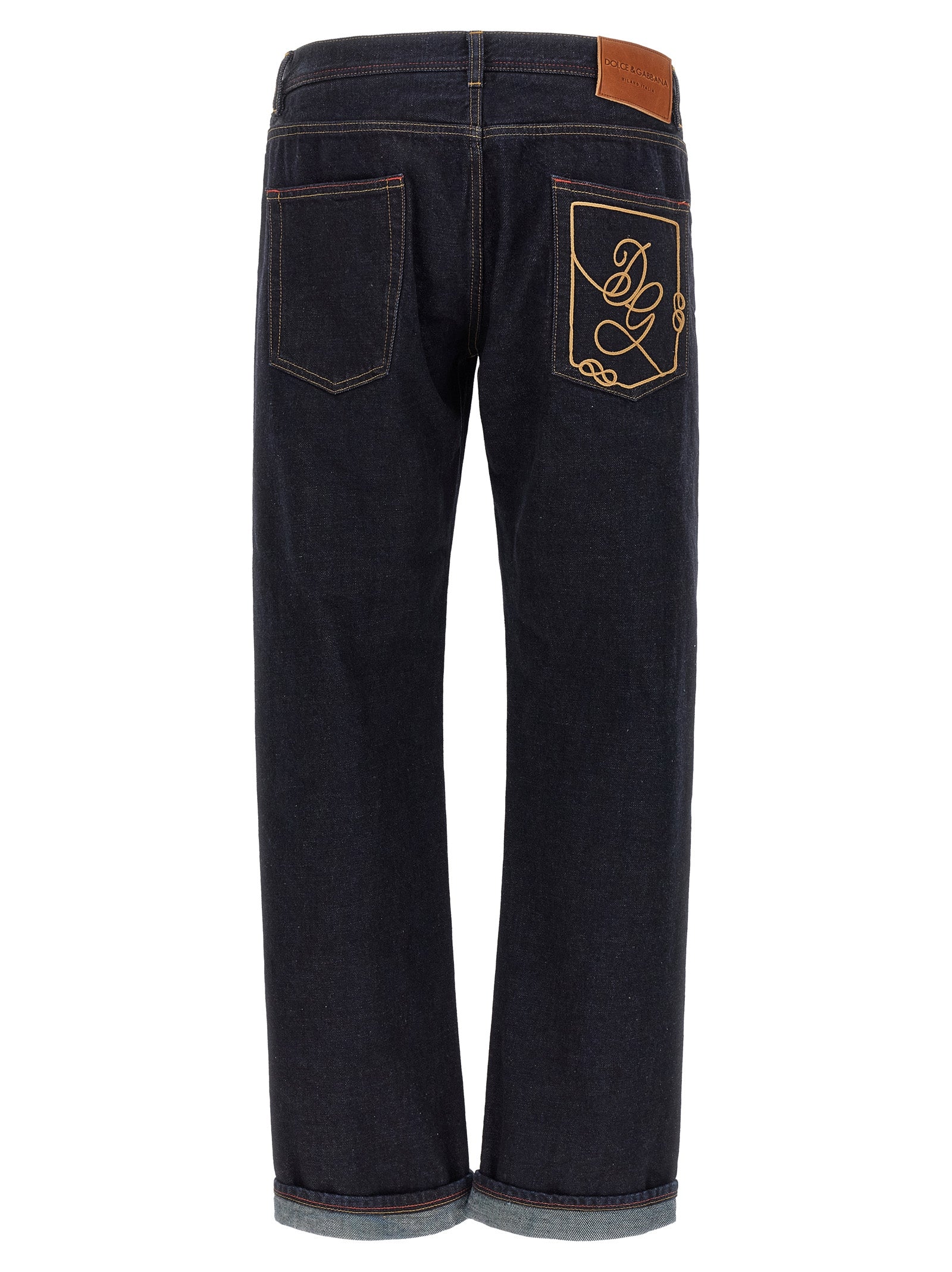 Jeans en denim coton bleu Dolce & Gabbana, coupe classique, détails de couture visibles, portés sur un mannequin.