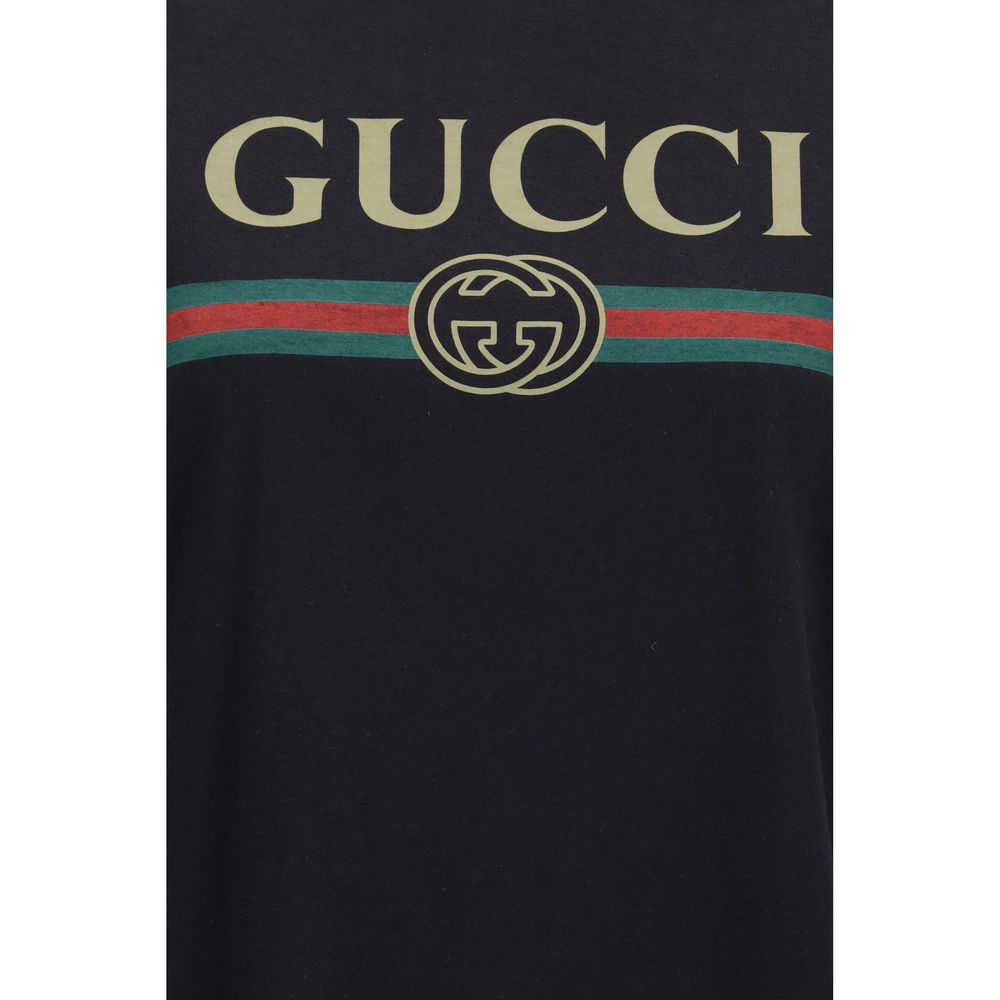 T-shirt en coton noir Gucci pour homme, avec logo emblématique Gucci sur le devant, coupe classique et style décontracté.