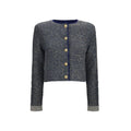 Cardigan en polyamide bleu de la marque Balmain, détails du tissu et coupe élégante visibles sur l'image.