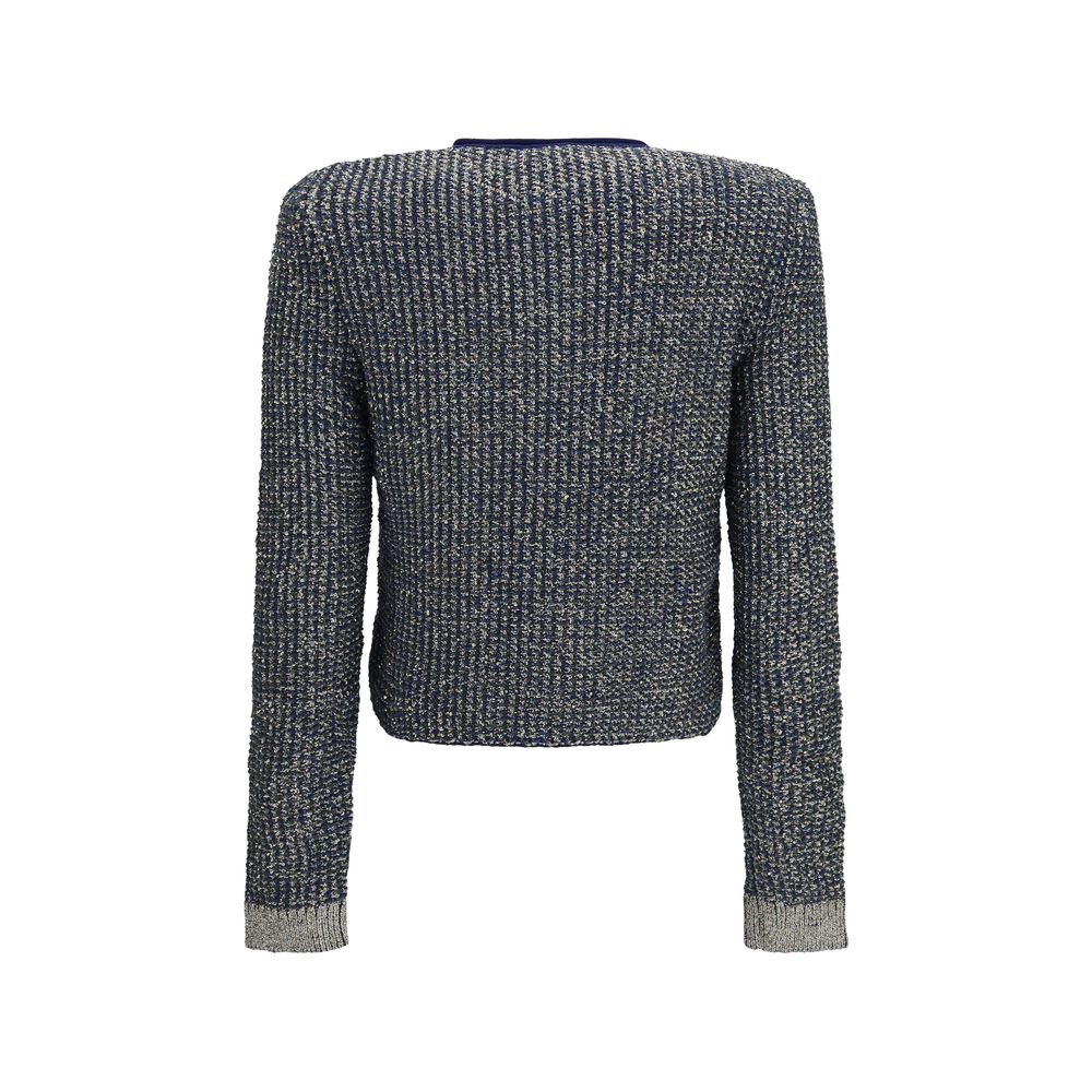 Cardigan bleu en polyamide de la marque Balmain, détail en tissu léger avec fermeture à boutons visible.