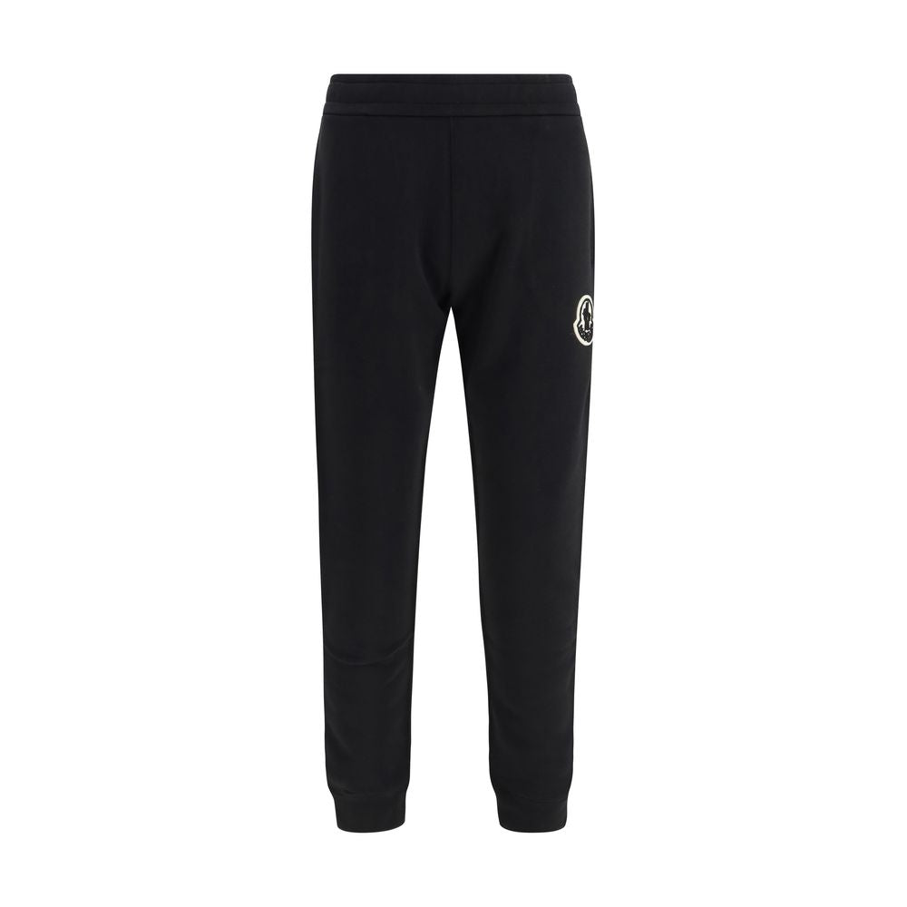 Pantalons de sport noirs en coton Moncler, coupe décontractée, avec détails de couture et logo sur la jambe.