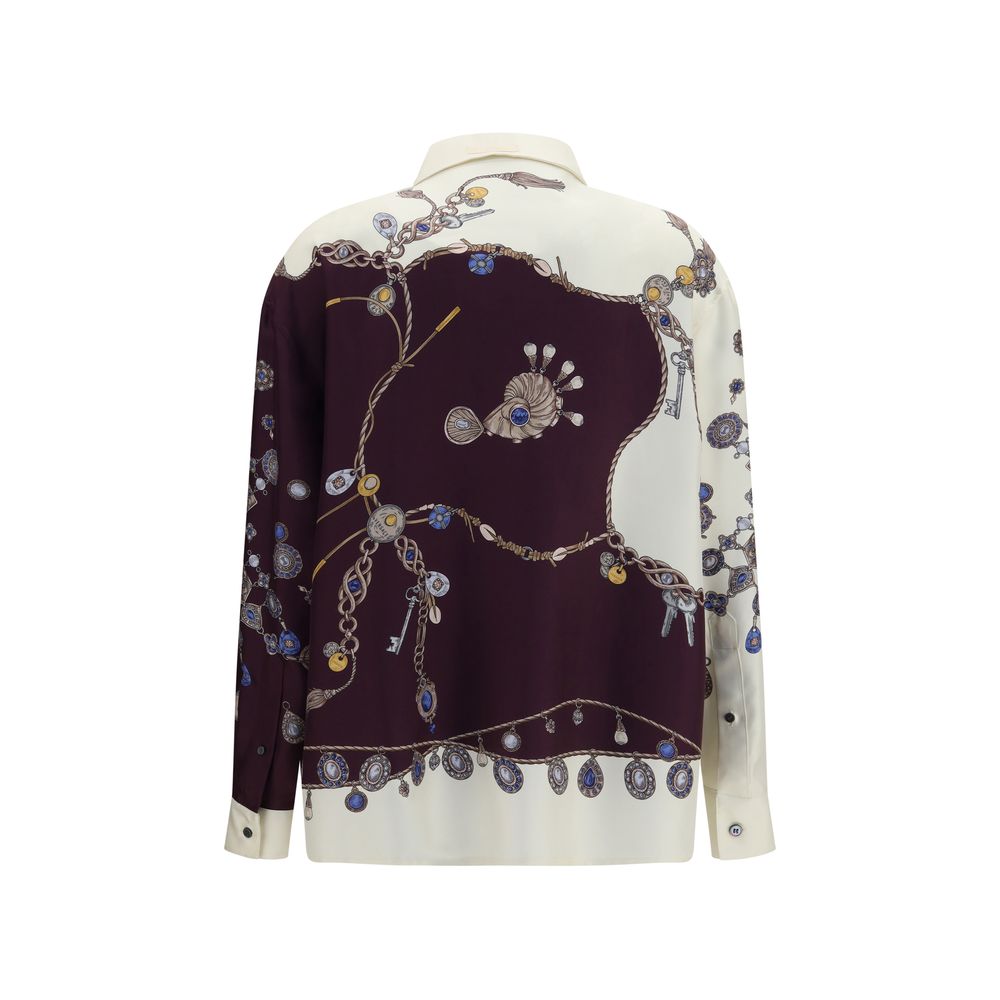 Chemise en soie multicolore Versace avec motif élégant, affichant un design sophistiqué et coloré.