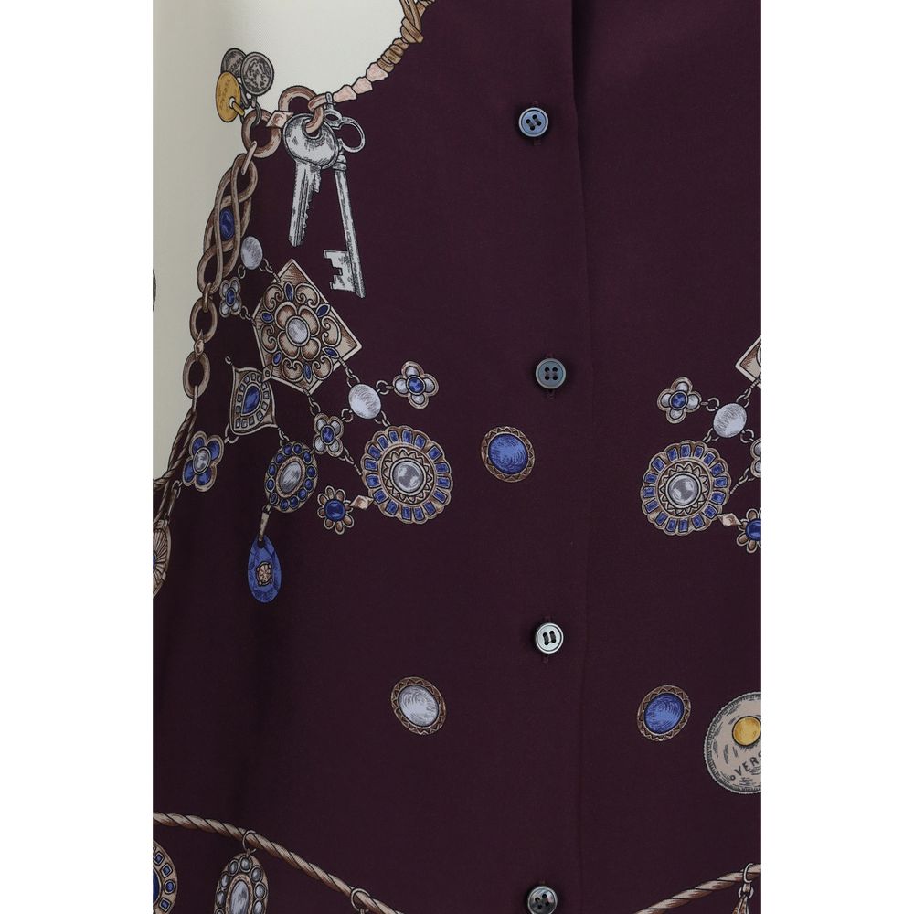Chemise en soie multicolore Versace avec motif coloré, design élégant et tissu luxueux visible sur l'image.